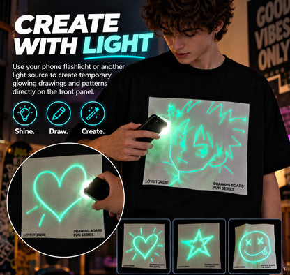 👕Light-Reactive Glow in the Dark Drawing T-Shirt – Interactive Light Doodle Graphic Tee for Parties & Festivals